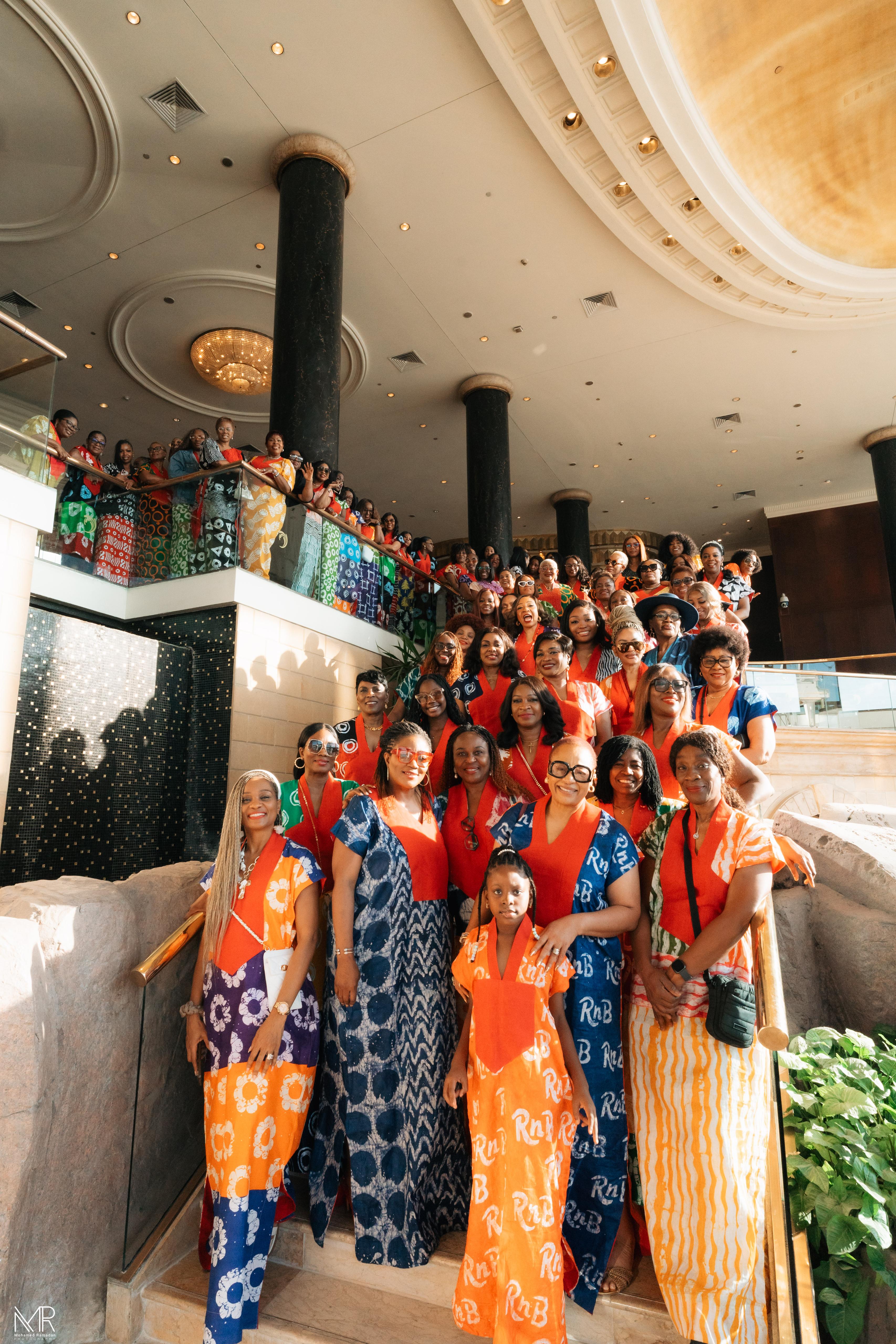 Wedding guests on a grand staircase in coordinated outfits